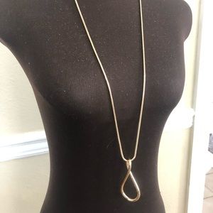 Long gold colored necklace